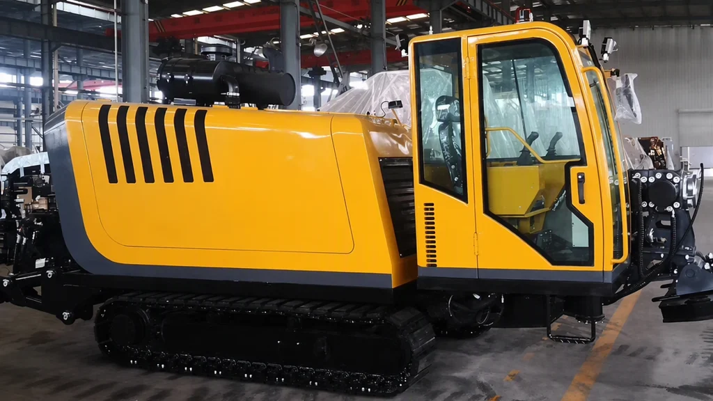 Yuji crawler-mounted geological drilling rig undergoing mast erection and hydraulic testing in factory yard