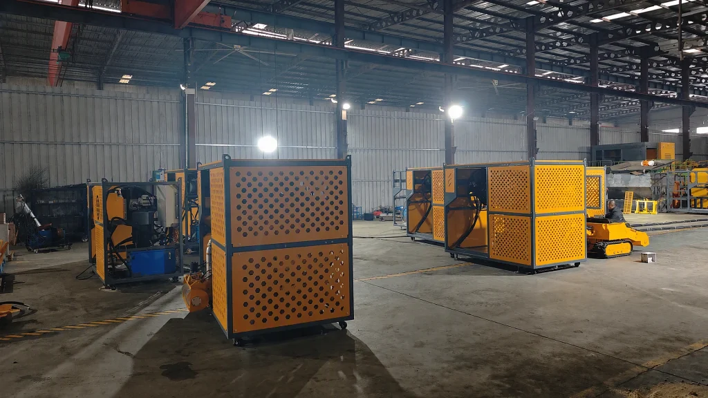 Yuji submersible crawler sludge dredging robot with cutting auger and slurry pump on factory floor